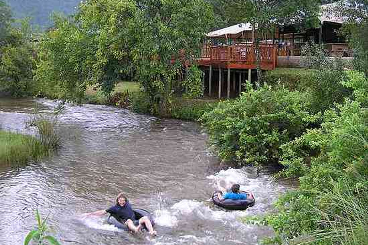 Guests tubing on the Sabie River below the camp