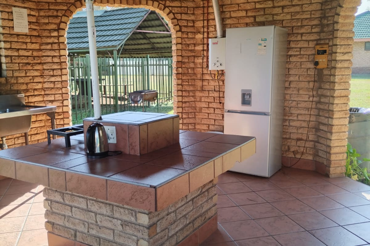 Communal self catering kitchen with fridge and prep counters