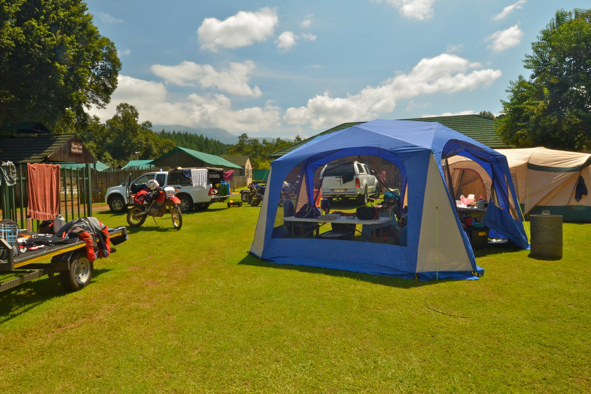 Campers set up under the trees at Sabie River Camp